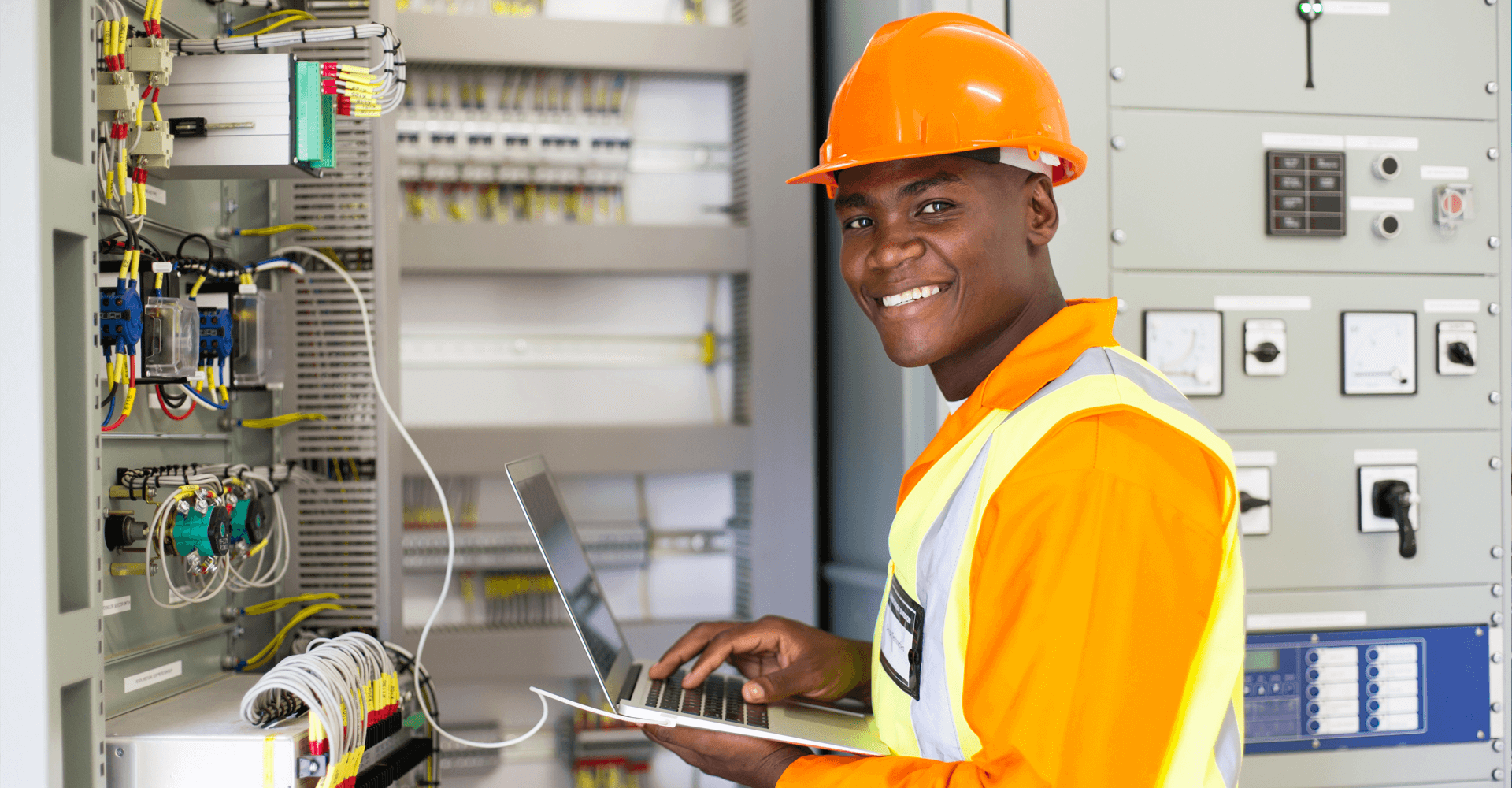 Man in protective gear and laptop