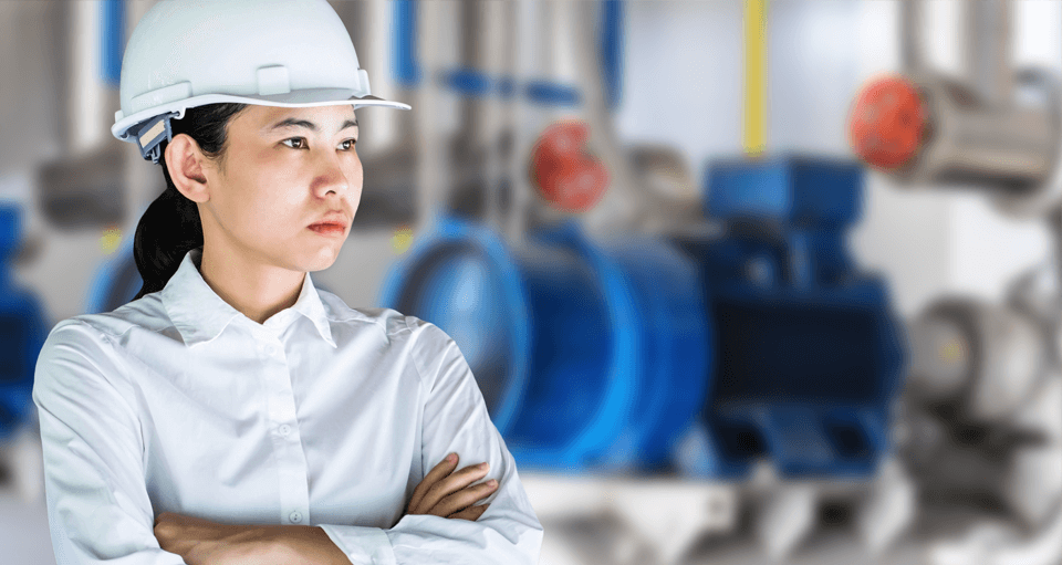 A woman wearing a white safety helmet